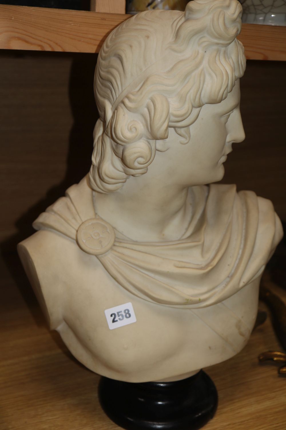 A composition bust of Apollo, marked 912 to the reverse, height 49cm